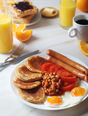 Traditional British breakfast with sausages and beans