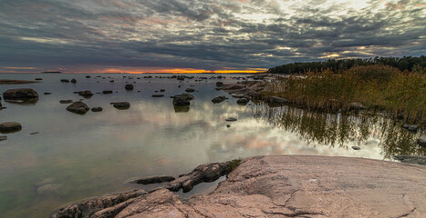 Sunset and shallow coast on the Baltic Sea in the Gulf of Finland near Helsinki.
