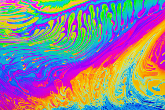 Psychedelic multicolored background abstract. Rainbow colors. patterns background. Photo macro shot of soap bubbles.
