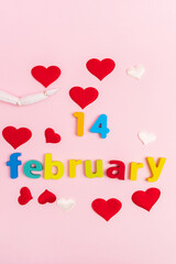 Valentines Day 14 february gift selection pink background, hearts top view. Vertical photo