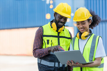 Foreman or worker work at Container cargo site check up goods in container. Foreman or worker checking on shipping containers. Logistics and shipping.