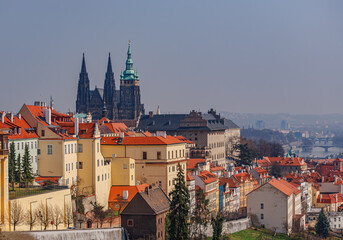 Fototapeta premium View of the city of Prague in the morning haze from the hill.