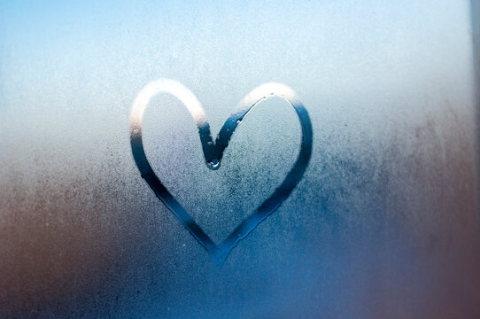 Rainy weather, the inscription heart on the sweaty glass. Valentine's Day. love.