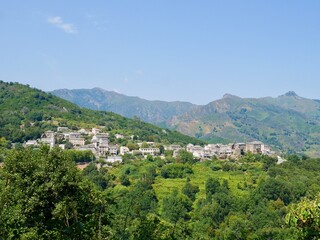 Fototapeta na wymiar Panoramic view of Pietra di Verde, a dreamy mountain village nestled in the mountains of Castagniccia. Corsica, France.