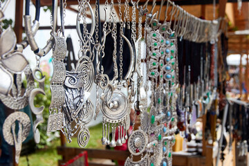 kazakh national handmade silver jewelry. Selective focus with blurred background