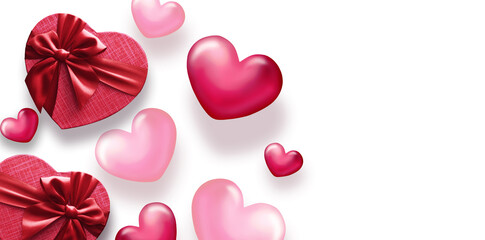 Fototapeta premium Valentine's day decorations with heart shaped gift boxes and small hearts on white background. Top view.