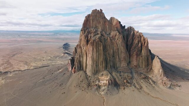 Aerial views of the natural wonder of New Mexico Valley, southwest United States of America. Cinematic Shiprock landscape aerial 4K panorama from drone. Epic nature wilderness background footage