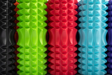 Close-up multicolored massage rollers for body massage. Foam myofascial rollers for physiotherapy. Top view