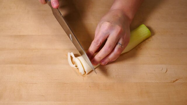 Cutting Leeks on Wooden Cutting Board