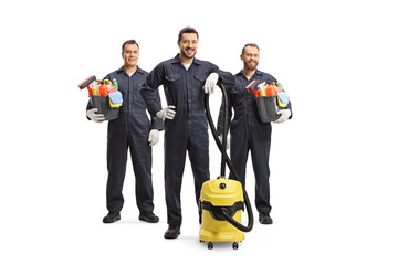 Professional cleaners in uniforms with a vacuum cleaner and cleaning supplies