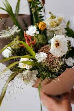 photo of a bouquet created from wild fresh spring flowers photographed on a white background in daylight, flowers for cut out white background