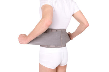 Orthopedic lumbar corset on the human body. Back brace, waist support belt for back. Posture...