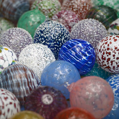 Close up of brightly colored glass balls made by local artisan