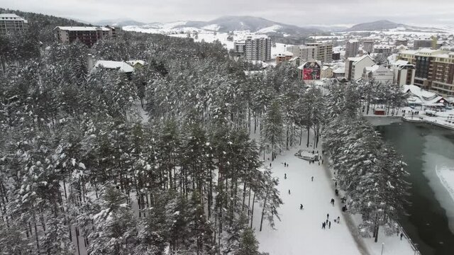 Mountain resort Zlatibor, Serbia, in winter, with kids playing on the snow