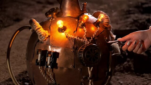 Steampunk. Female hand turns on the light bulbs on the dewar Vessel close-up.
