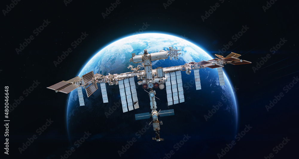 Fototapete International space station in 2022 on orbit of Earth planet. ISS with astronauts in outer space on orbit. View on surface of planet. Elements of this image furnished by NASA