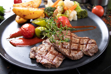 presentation with grilled beef and vegetables