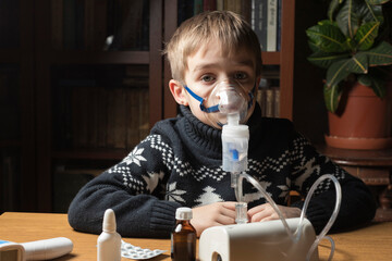 A sick child does inhalation. Inhales the medicine through the mask. Prevention of lung diseases