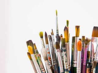 Obraz premium many different brushes for painting, artist's working brushes close-up, copy space