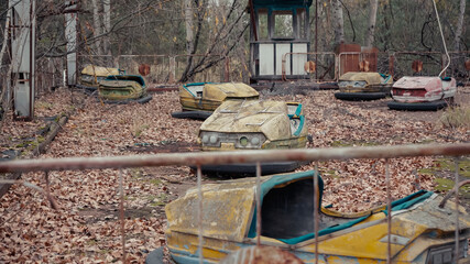 old damaged cars in amusement park of chernobyl city.