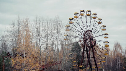 old ferris wheel in amusement park of chernobyl abandoned city.