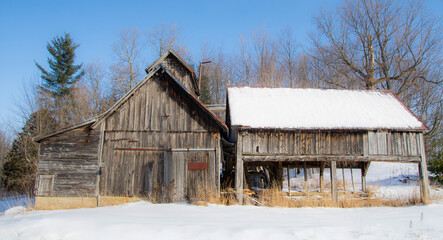 Details of an old barn in a winter countryside landscape in Quebec, Canada