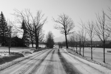 Road in a winter countryside landscape in the province of Quebec, Canada
