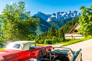 Vintage cars in front of slovenian Alps next to Logar valley, Slovenia © streetflash