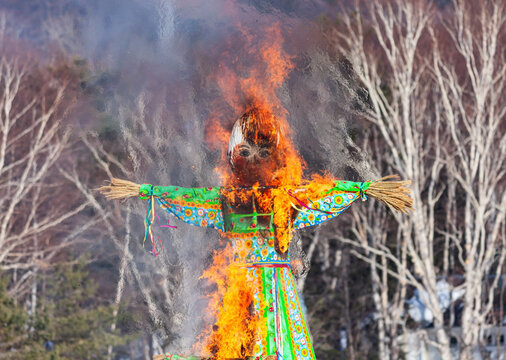 Maslenitsa, a traditional Russian non-official holiday dedicated to the approach of spring (Eastern Slavic celebration Shrovetide) - burning effigy made from straw.