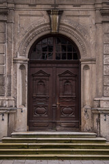 Munich, Germany - December 20 2021: Old Decorative Main Entrance Wooden Door.