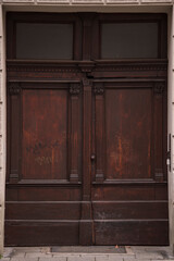 Fototapeta na wymiar Munich, Germany - December 20 2021: Old Decorative Main Entrance Wooden Door.