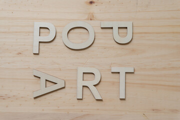 "pop art" in wood type isolated on a wooden surface