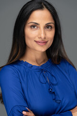 Studio headshot of beautiful Asian Indian woman.