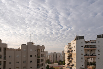 Architecture in Israel, Blue puffy cloud sky and buildings in Beer Sheba Neighborhood. Israel architecture concept