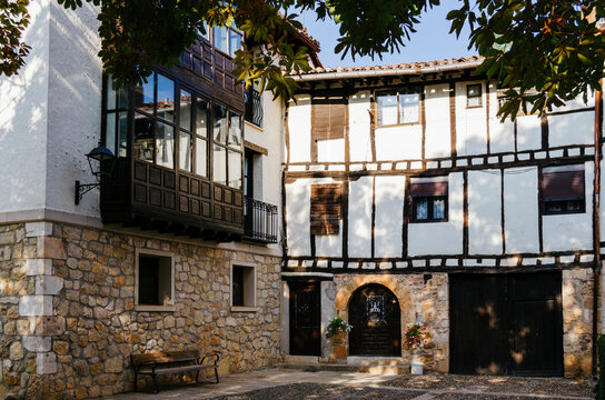 Typical corner of a white adobe and half-timbered house in Covarrubias, Burgos, Castilla y León, Spain.