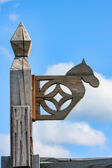 Wooden horse sign in the harsh light in the morning