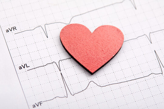 Printed ECG, as background, red heart