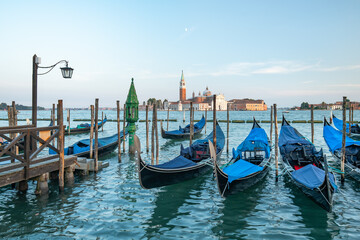 Fototapeta na wymiar View of the island San Giorgio Maggiore with gondolas, Venice, Italy