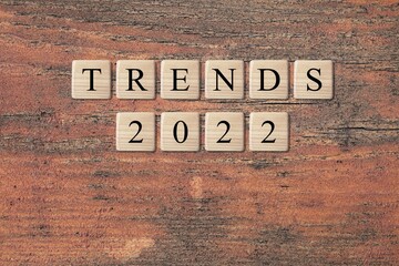 Concept of flips wooden blocks and change the 'TRENDS  2022'. New trends of fashion.