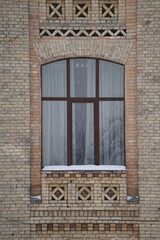 Fototapeta na wymiar old window in the old brick wall