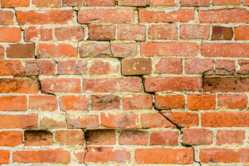 Old brick wall with big crack