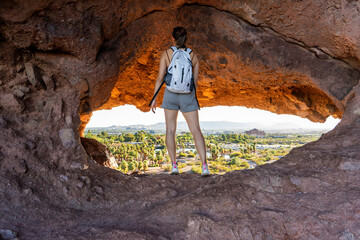 The view of Phoenix through the Hole-in-the-rock at Papago Park in Phoenix, Arizona