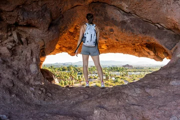 Fotobehang The view of Phoenix through the Hole-in-the-rock at Papago Park in Phoenix, Arizona © yobab