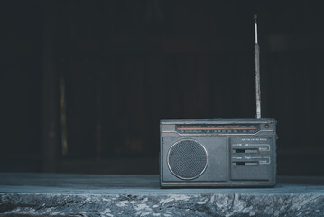 Retro broadcast antique radio on vintage background