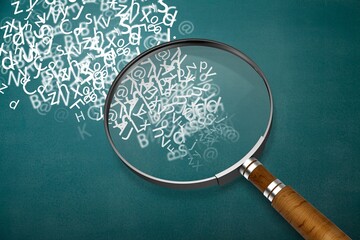 Magnifying glass on many English alphabet letters. Keyword searching.