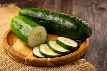 Fresh cucumber sliced ​​on the table.