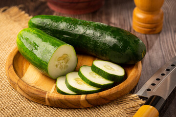 Fresh cucumber sliced ​​on the table.