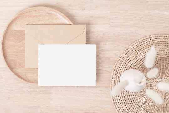 Blank paper cards, Greeting card Mockup with pampas grass on a wooden plate, beige background, Minimal beige workplace composition, flat lay, mockup