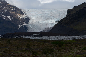 Beautiful Cinematic Aerial view of the massive Svinafellsjokull Glacier in Iceland and its lagoon caused by global warming