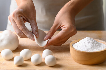 Hand making Tangyuan, Chinese dessert made of ball glutinous rice flour